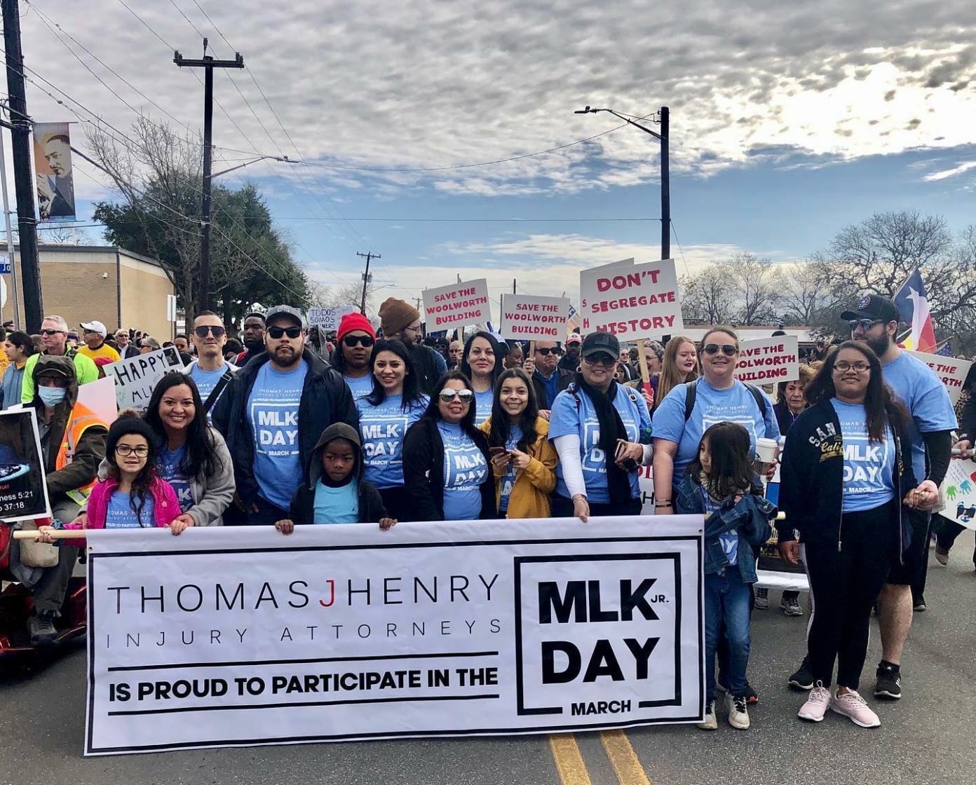 Thomas J. Henry Law employees holding a banner during MLK March 2020